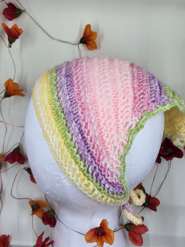 Knit Bandana in pastel colors displayed on a mannequin head, perfect for any elegant occasion.