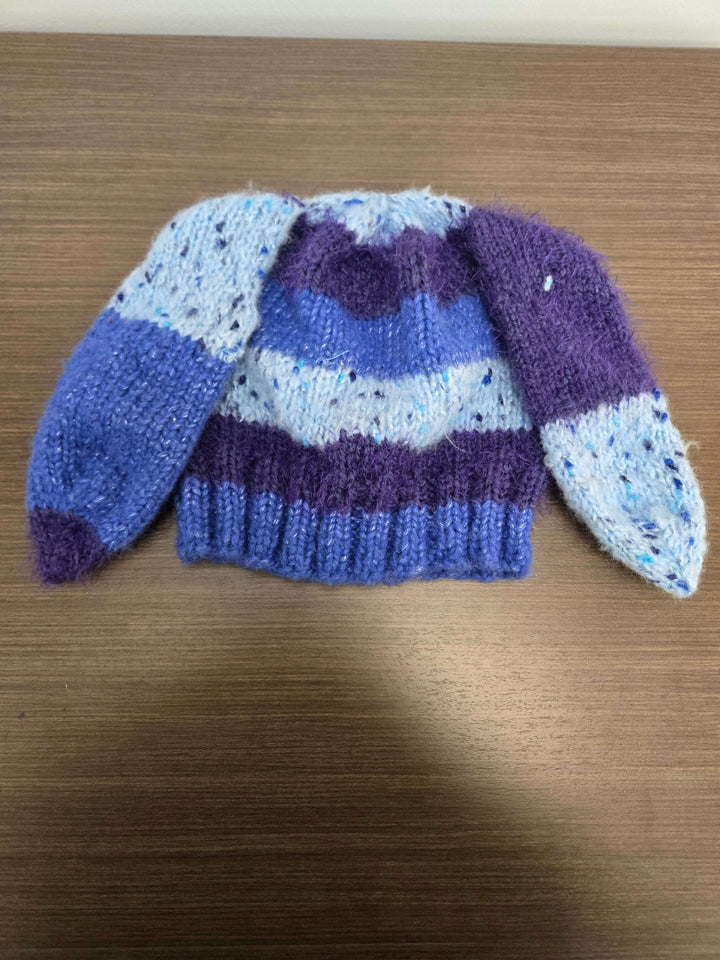 Bunny Hat with blue and purple stripes and long ear flaps, perfect for a cute and warm accessory.