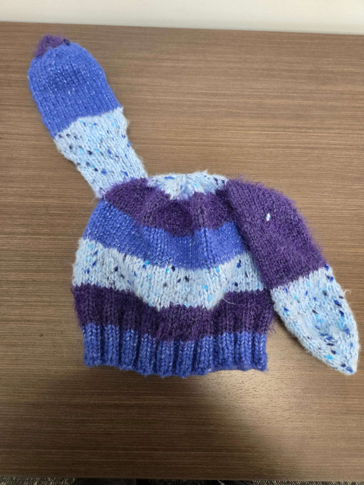 Bunny Hat in blue and purple with bunny ears, perfect for keeping warm in cold weather.