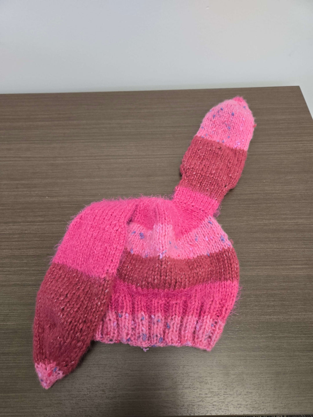 Bunny Hat in pink with long floppy ears, made from a cozy multi fiber blend for warmth this season.