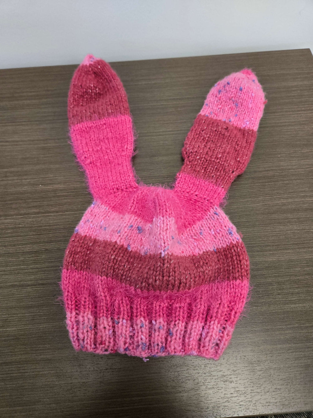Bunny Hat in pink, featuring cute rabbit ears, perfect for warmth and style in the cold season.