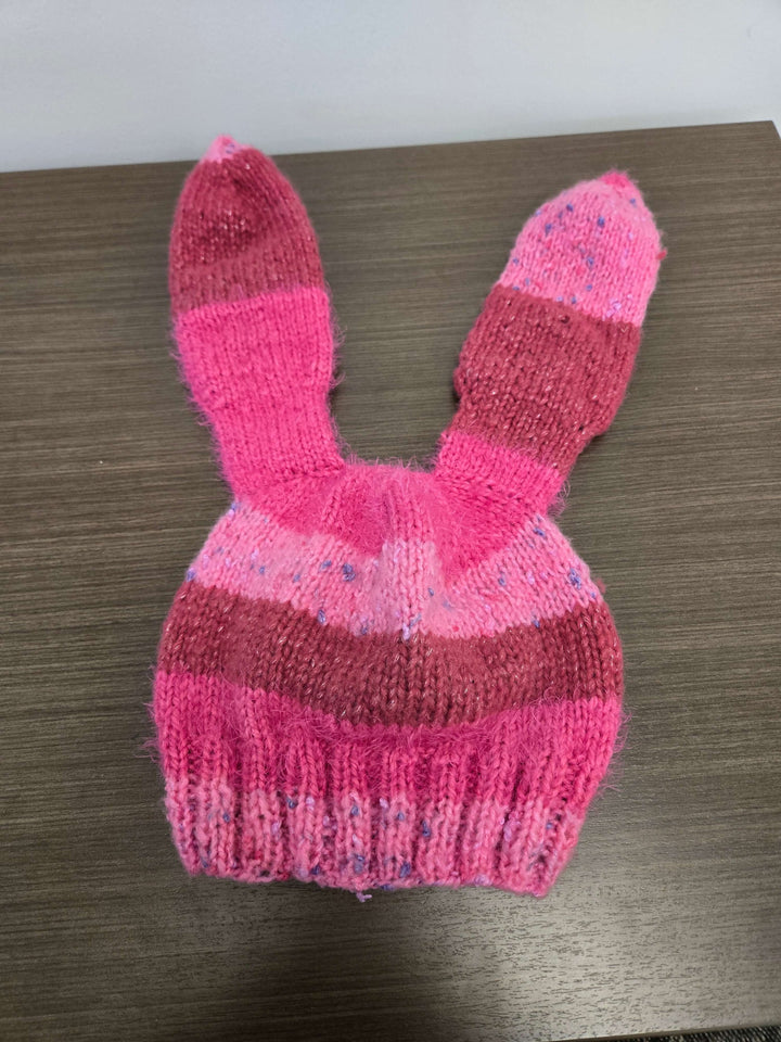 Bunny Hat in pink, featuring cute rabbit ears, perfect for warmth and style in the cold season.