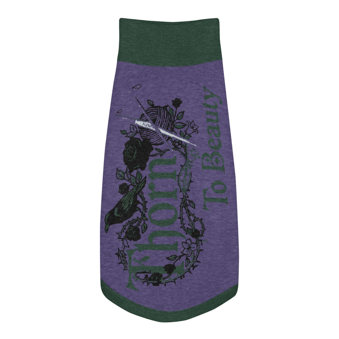 Knitted pet sweater featuring a unique design with text and floral elements in purple and green colors.