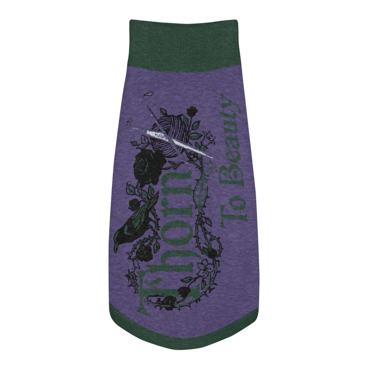 Knitted pet sweater featuring a unique design with text and floral elements in purple and green colors.