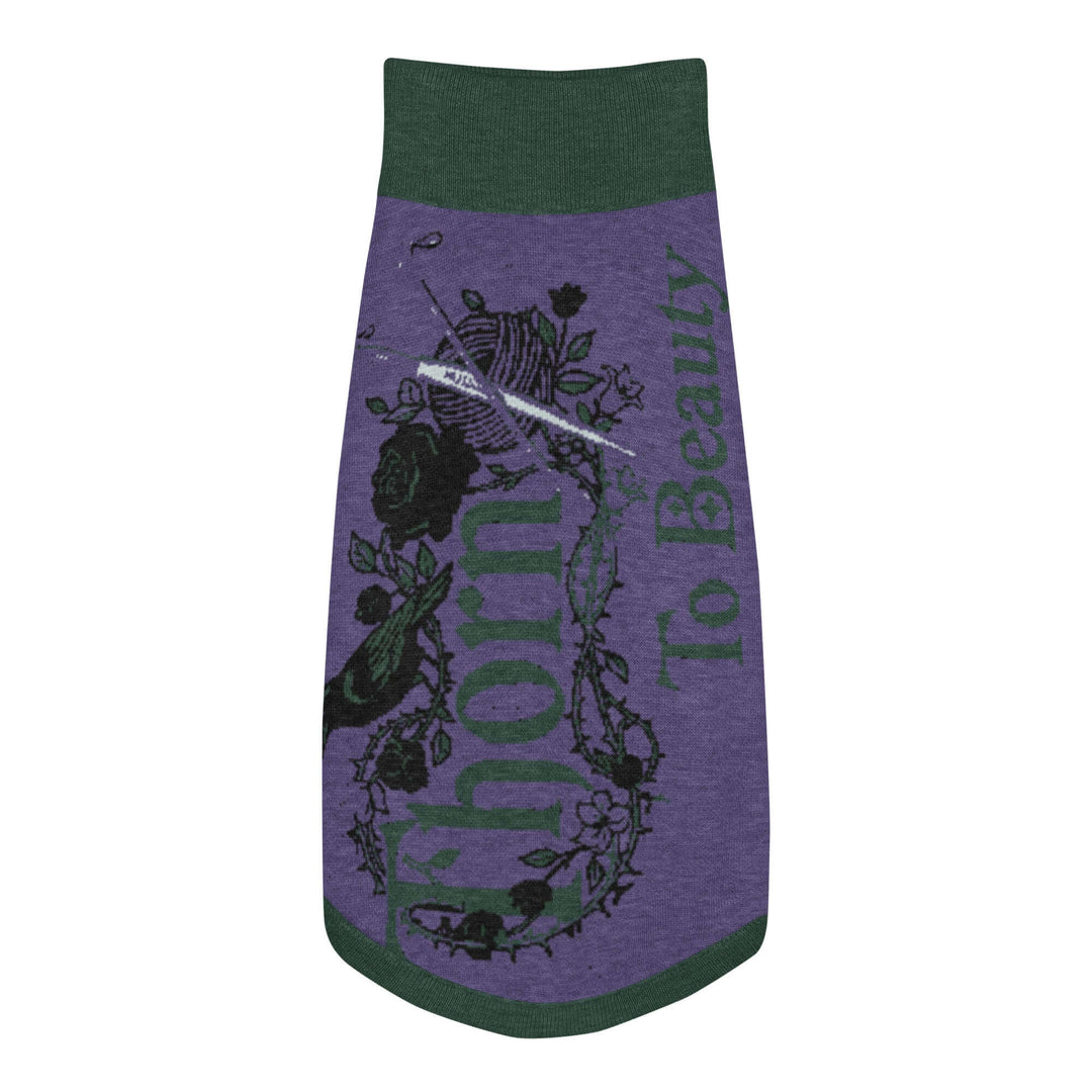Knitted pet sweater featuring a thorn and rose design with the text &