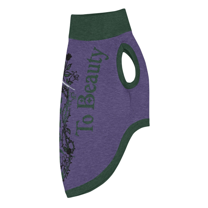 Knitted pet sweater in purple with green accents, featuring the phrase &