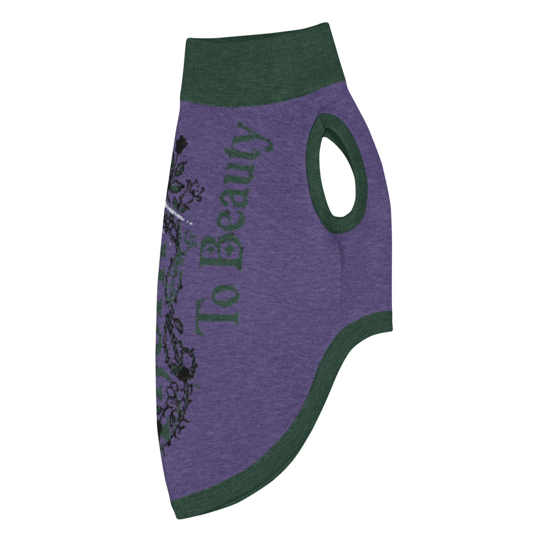Knitted pet sweater in purple with green accents and floral design, featuring the text &
